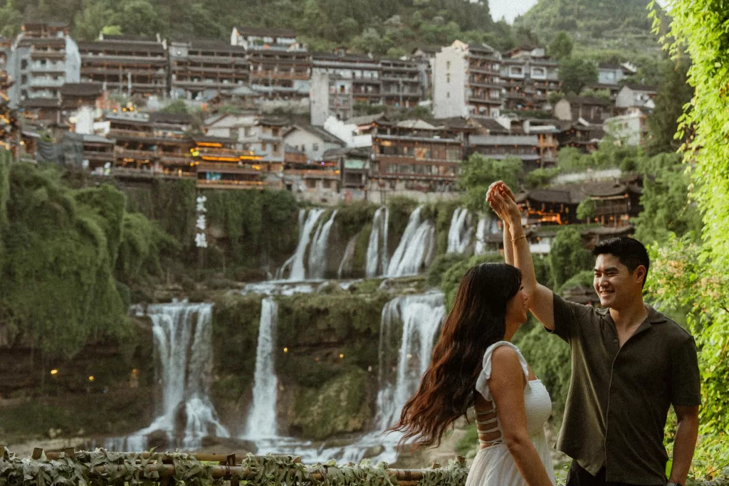Angelia and Chris in front of the famous waterfall at Furong Ancient Town