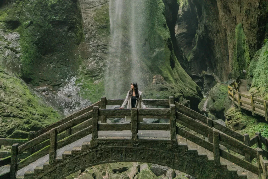 Angelia standing on bridge at Longshuixia Gap