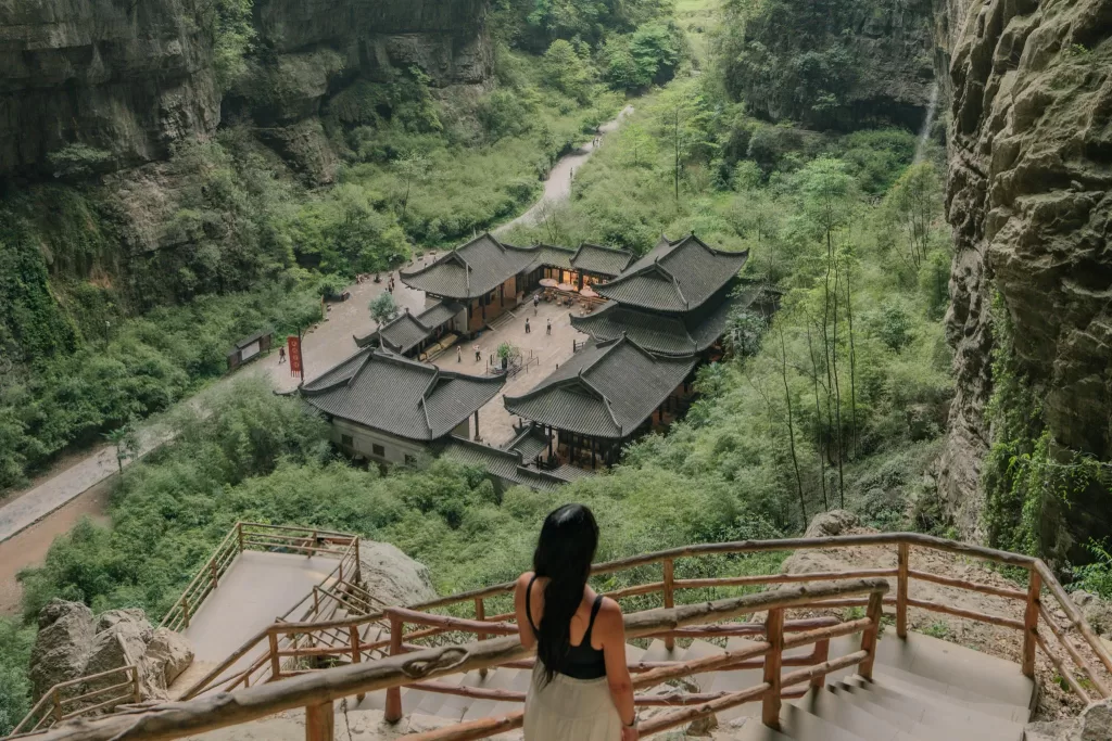 Angelia walking down stairs at Longshuixia Gap in Wulong