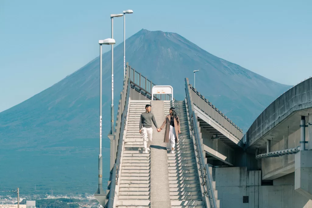 Stunning view of Mount Fuji from a pedestrian bridge in Japan.