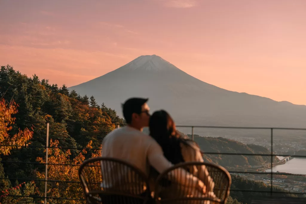 Chris and Angelia sitting in front of a Mt. Fuji view