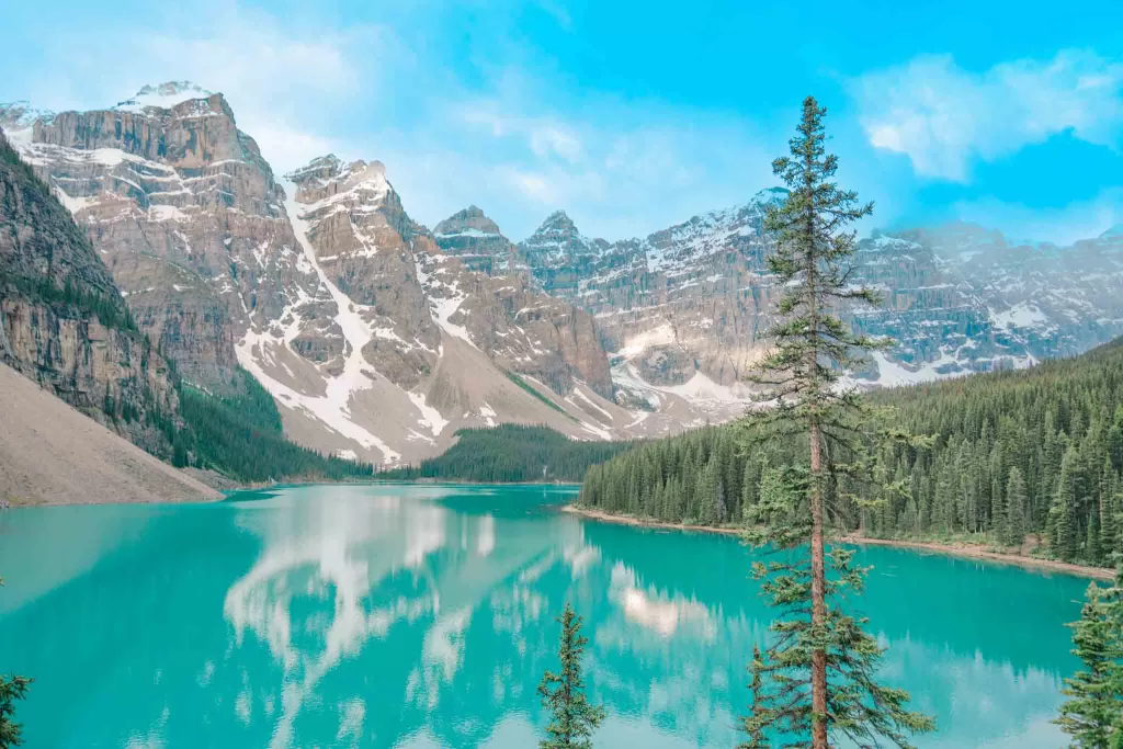 The blue lake and snowy mountains at Moraine Lake