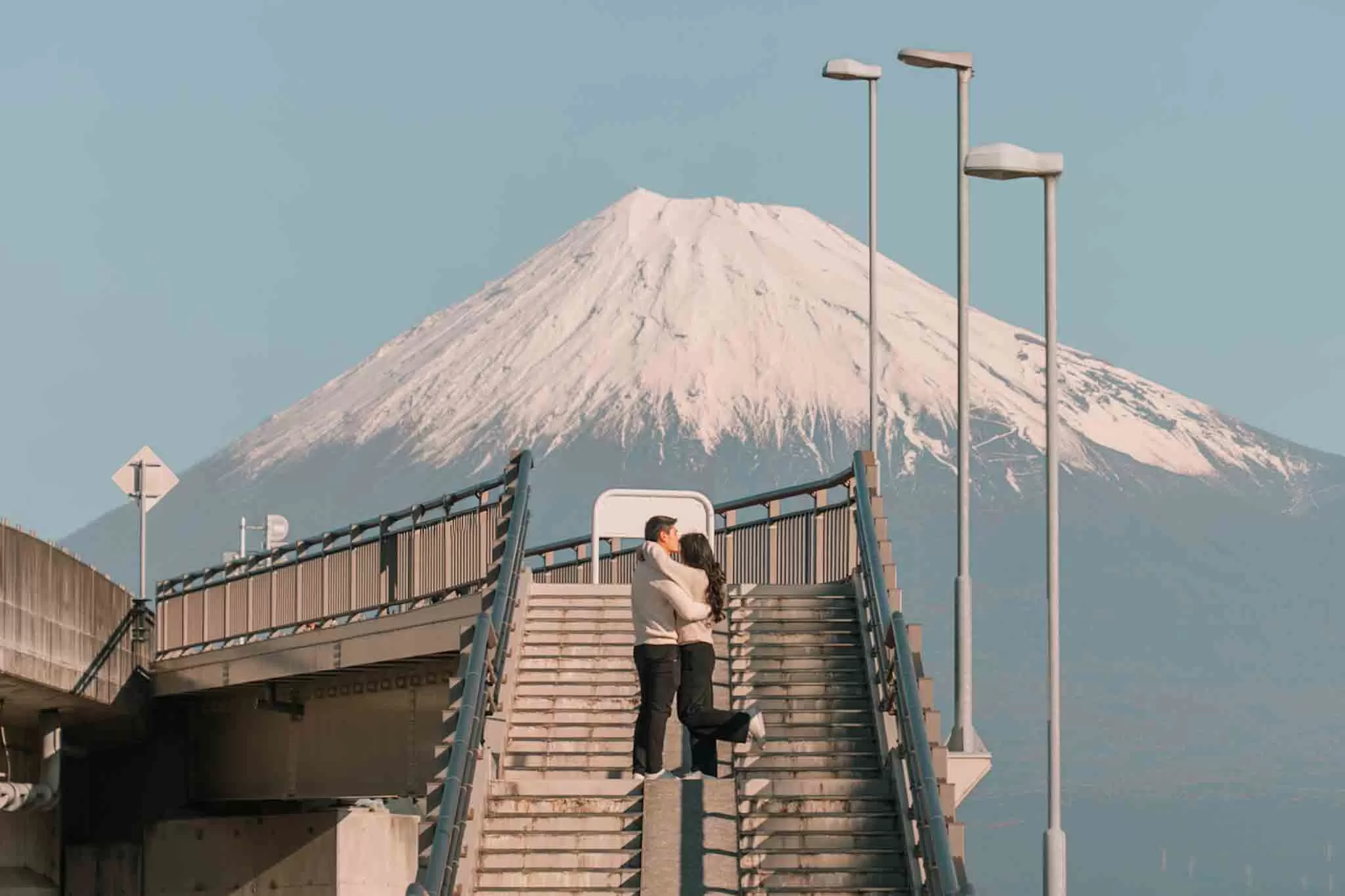 Chris kissing Angelia on the head at Fujisan Yumno Ohashi bridge in front of Mt. Fuji